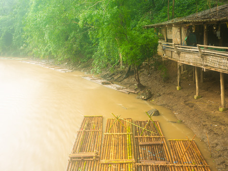 Bamboo Raft on The Stream where The Water Flows near The Local Home in Chiang Mai Thaialndの写真素材
