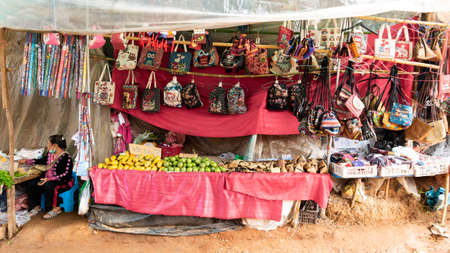 28 June'20 Doi Mon Jam Chiang Mai Province Thailand : The Old Woman Wearing a Mask under Her Chin in a Grocery Store on The Ground in The High Mountainのeditorial素材