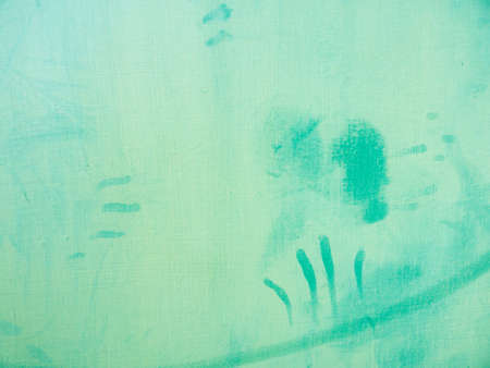 The Handprints and Abstract Designs are Attached on The Green Wallの写真素材