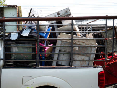 The Old Appliances are in The White Truck Parked on The Street