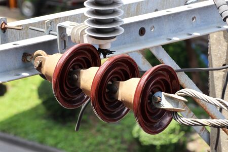 Suspension Type Insulators on Electrical Pole Close up viewの写真素材