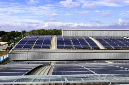 Solar PV Rooftop on Curve Roof under Beautiful Skyの写真素材