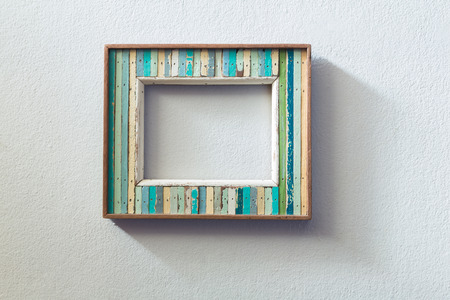 Retro style wooden picture frame hanged  pn white wall