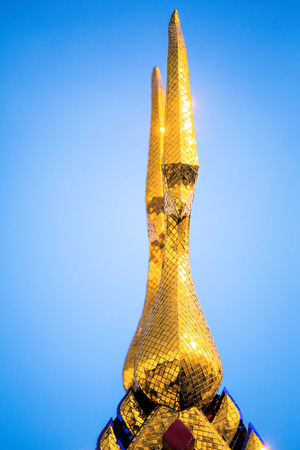 Ornemental roof points shaped like the head of the Garuda on the temple of Wat Phoの写真素材