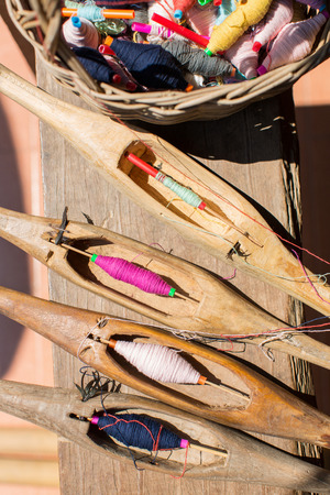 Weaving equipment with woven fabric in the backgroundの写真素材