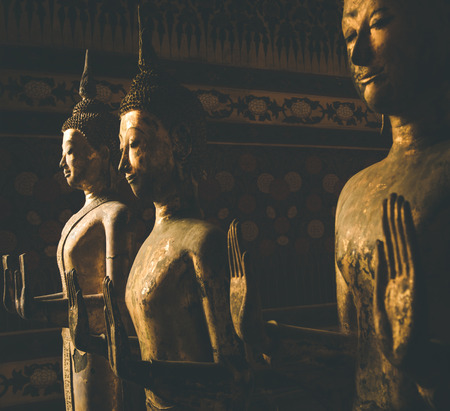Standing golden wooden buddha images in Kalayanamitr temple main hall , Bangkok, Thailandのeditorial素材