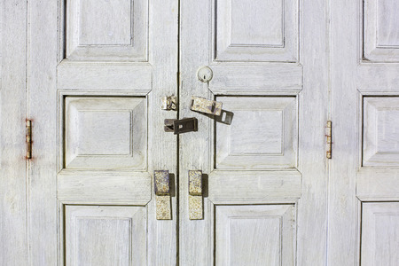 Folding wooden door frame with stained color in countryside.の写真素材