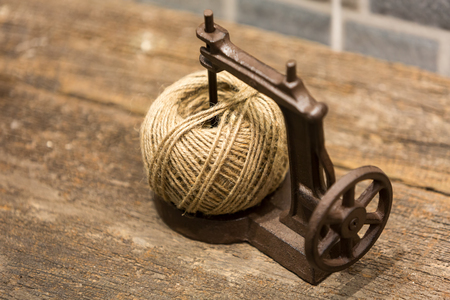 Brown yarn ball in a toy sewing machine, decoration item.の写真素材