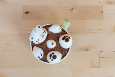 Polar bear floating in hot cappuccino  with 3D Latte Art .の写真素材