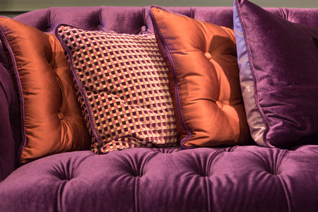 Close up of violet velvet sofa and cushions with vintage style.の写真素材