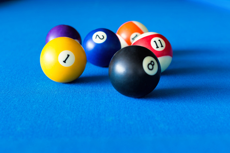 Colorful pool balls on a blue table.の写真素材