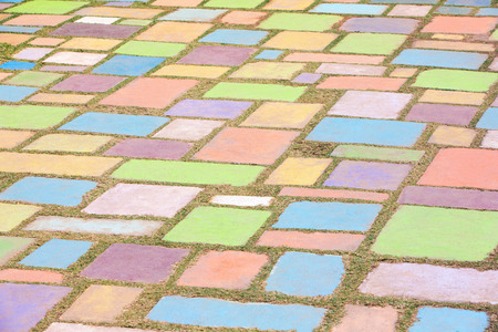 Background of colorful cement block play ground decorated in a garden with shallow depth of field.の写真素材