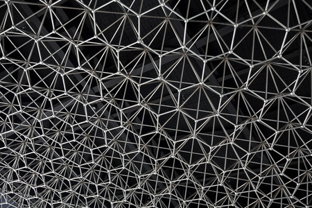 Modern style ceiling decoration with geometric shapes made of chrome metal on a black painted ceiling.の写真素材