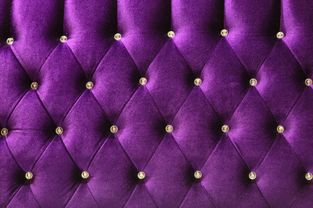 Background of purple Velvet / fabric modern sofa in close up.の写真素材