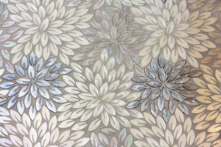 Background and texture of luxury floor tiles made from natural shell in flower shapes.