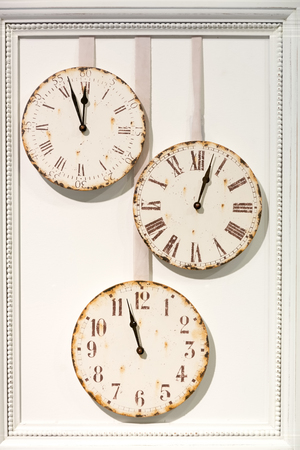 Decoration frame with off white retro round watch faces.