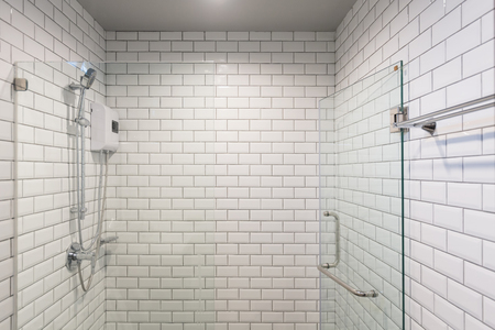 Big glass shower box in a clean white white room.の写真素材