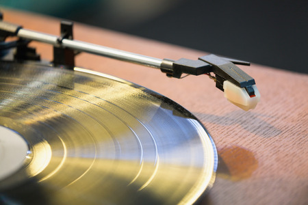 Old style gramophone and black vinyl disk.