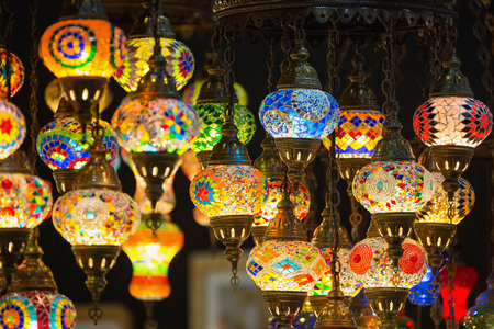 Colorful Moroccan style lanterns lamp hanging down from ceiling.の写真素材