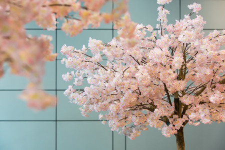 Artificial sakura blossom trees decorated in side a modern building.の写真素材