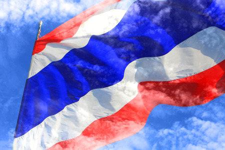 Flag of Thailand with blue sky and cloud