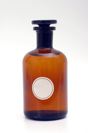 Glass bottle with empty white tag の写真素材