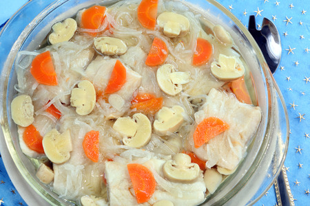 Herring fish in oil with carrot, onion and mushrooms