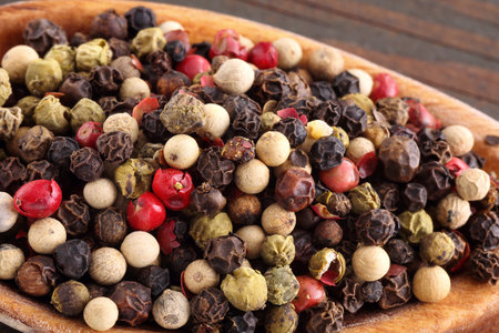 Color pepper on wooden spoon