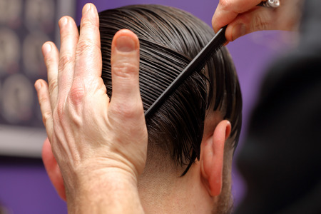 Barber modeling hair by combの写真素材