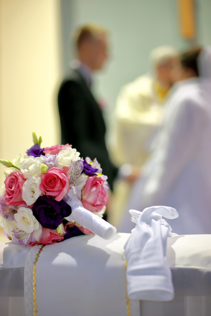 The brides bouquet at the church on the kneelerの写真素材
