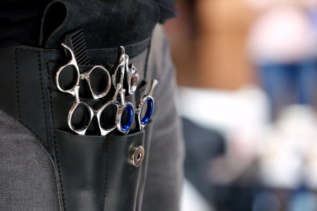 Barber with tools waiting for client and empty space for textの写真素材