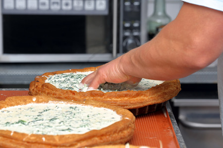 Vegetable tart ready for baking in the bakery

の写真素材