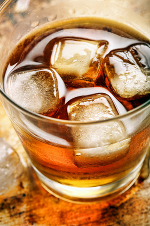 Cold drink with ice on vintage backgroundの写真素材