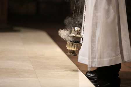 Incense during Mass at the altar and empty space for text