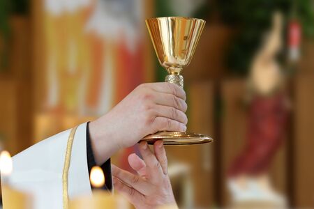 Priest celebrate mass at the church and empty place for text