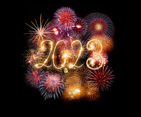 Happy new year greeting card with 2023 golden numbers and fireworks series on dark background with empty space for textの写真素材