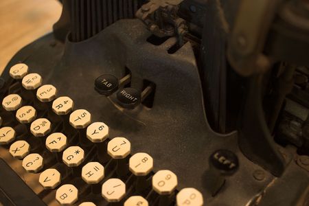 Vintage black typewriter with ivory keys