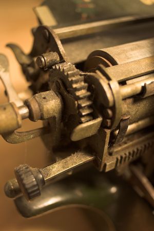 Detail view of antique typewriter carriage showing gearsの写真素材