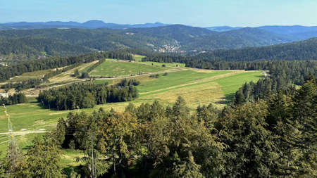 A view from the SÅotwiny Arena ski slope to the Beskid SÄdecki mountains, lots of forests and greeneryの写真素材
