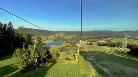A view from the SÅotwiny Arena ski slope to the Beskid SÄdecki mountains, lots of forests and greeneryのeditorial素材