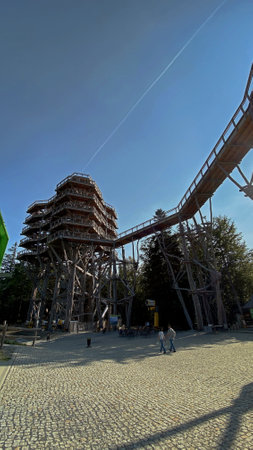 Krynica ZdrÃ³j, Lesser Poland Voivodeship, Poland-September 14.2020. Year tourist lookout tower in the treetops at the top of SÅotwiny Arena ski stationのeditorial素材