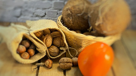 walnuts and hazelnuts in burlap bags coconuts in a wicker basket