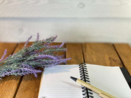 a table made of oak boards you can see jars on them there is a bouquet of lavender a wooden cup with...