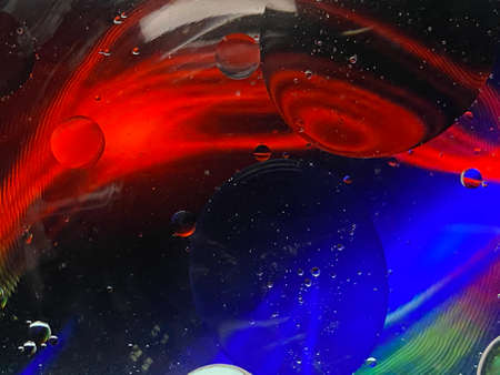 abstract macro photography colorful background oil drops and air bubbles floating on waterの写真素材