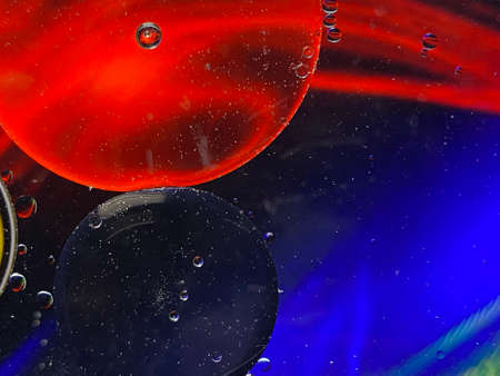 abstract macro photography colorful background oil drops and air bubbles floating on water