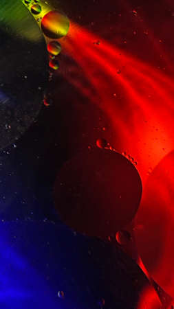 abstract macro photography colorful background oil drops and air bubbles floating on water