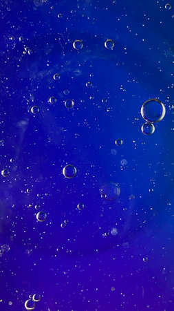 abstract macro photography colorful background oil drops and air bubbles floating on water