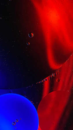 abstract macro photography colorful background oil drops and air bubbles floating on waterの写真素材