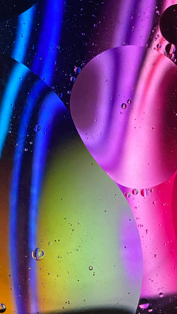 abstract macro photography colorful background oil drops and air bubbles floating on water