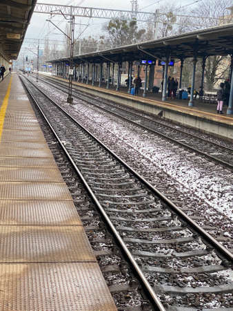 Sopot, Pomorskie Voivodeship, January 8, 2022. Peony railway station covered with a roof, Pendolino fast train approachingのeditorial素材